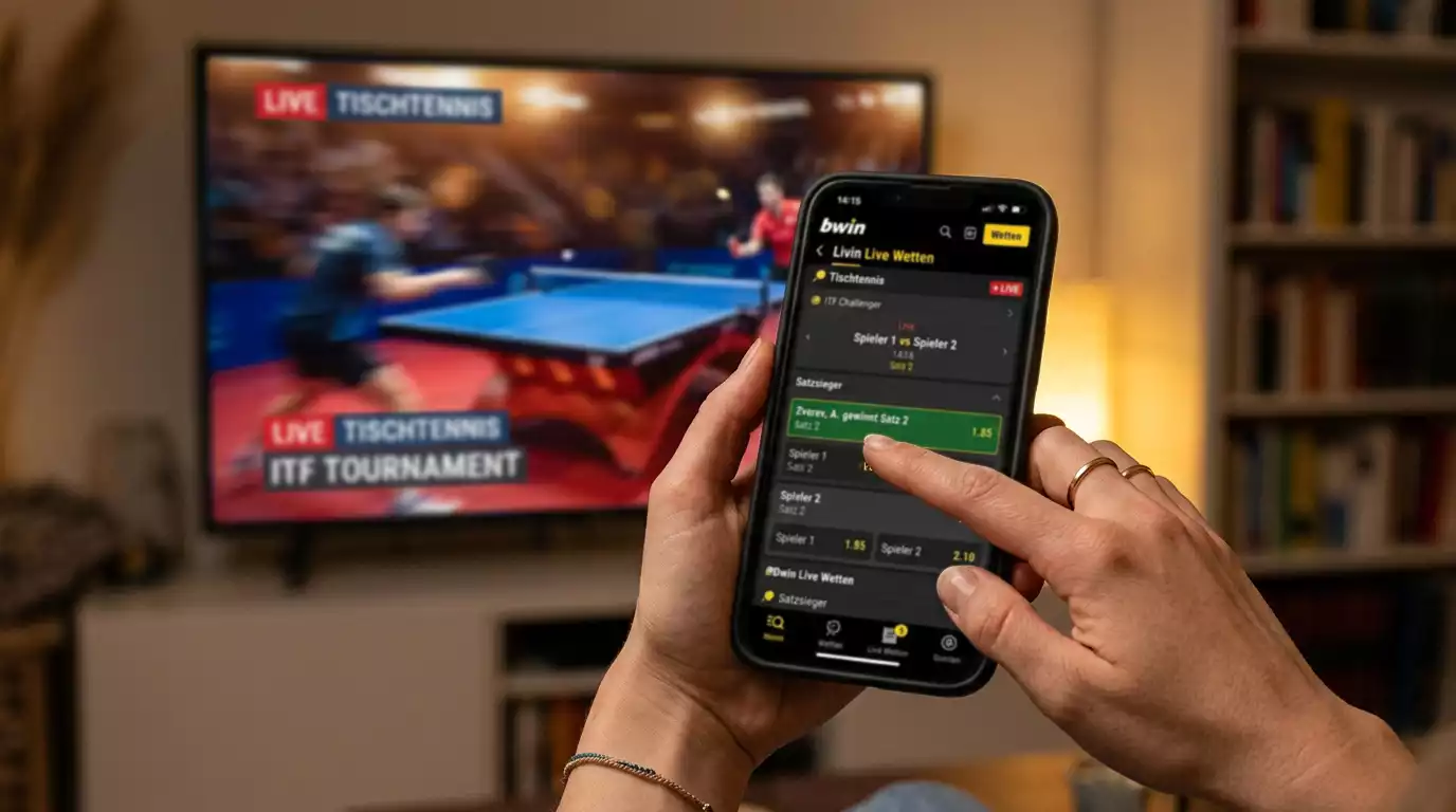 Finger tippt live auf eine Wettoberfläche während ein Spiel läuft