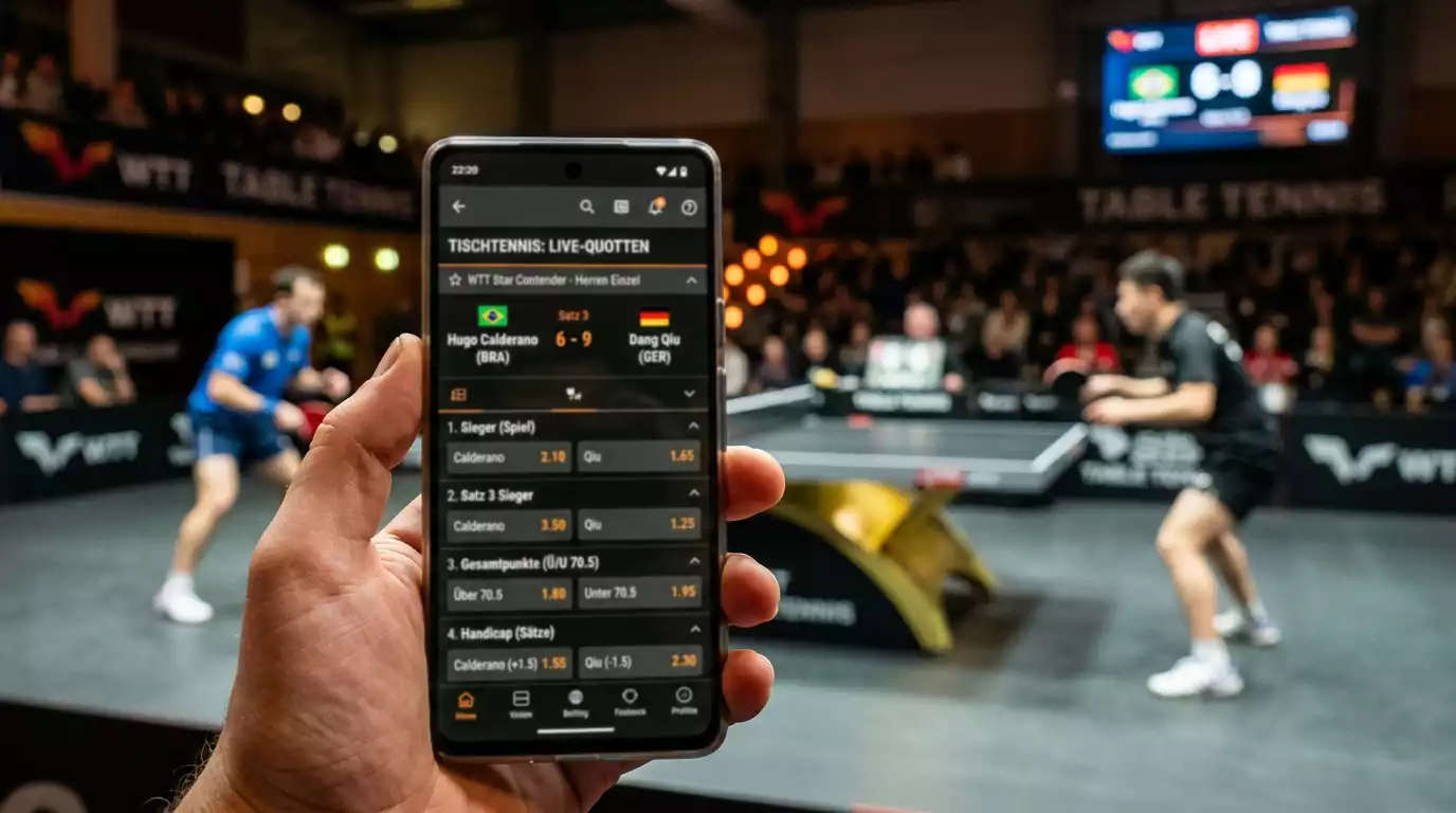 Smartphone mit Quotenliste neben einem laufenden Tischtennisspiel